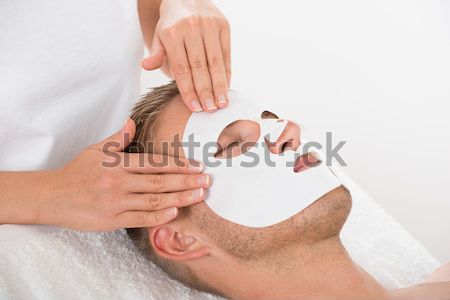 Physiotherapist Massaging Palm Of A Man Stock photo © AndreyPopov