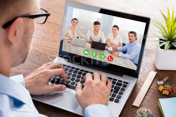 Stock photo: Businessperson Videoconferencing On Laptop