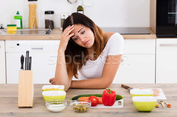 Unhappy Woman In Kitchen Stock photo © AndreyPopov