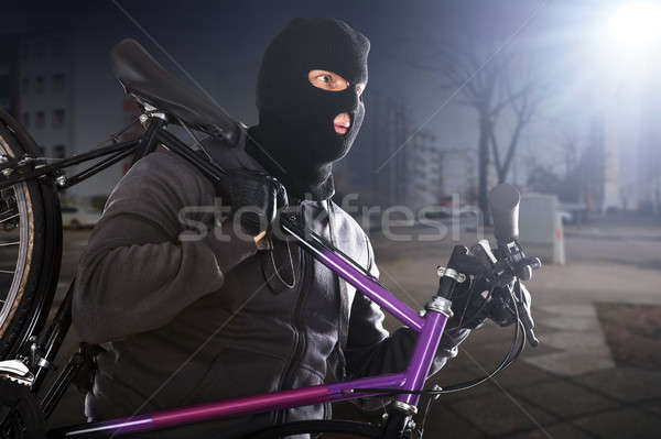 Tolvaj lop bicikli visel utca kéz Stock fotó © AndreyPopov