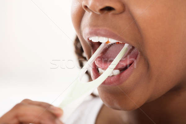 Girl Cleaning Her Tongue Stock photo © AndreyPopov