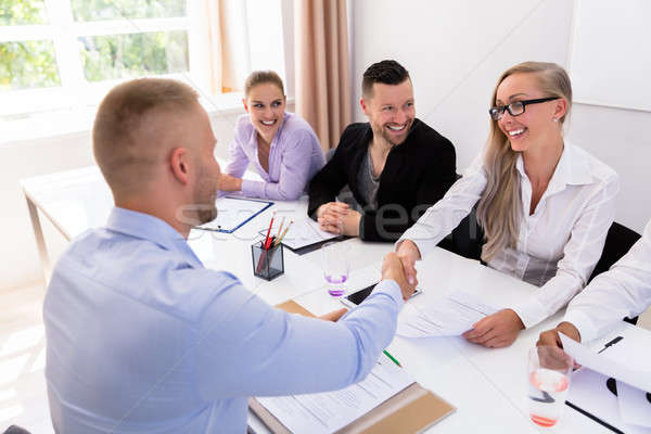 Businessman Shaking Hands At Interview Stock photo © AndreyPopov