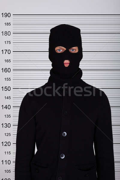 Burglar Standing Against Police Lineup Stock photo © AndreyPopov