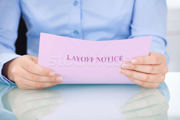 Businesswoman Reading Layoff Notice Stock photo © AndreyPopov