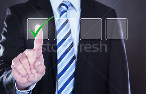 Businessman Pressing Check Mark Button Stock photo © AndreyPopov