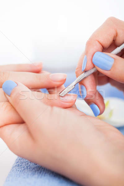 Manicurist Removing Cuticle From Nail Stock photo © AndreyPopov