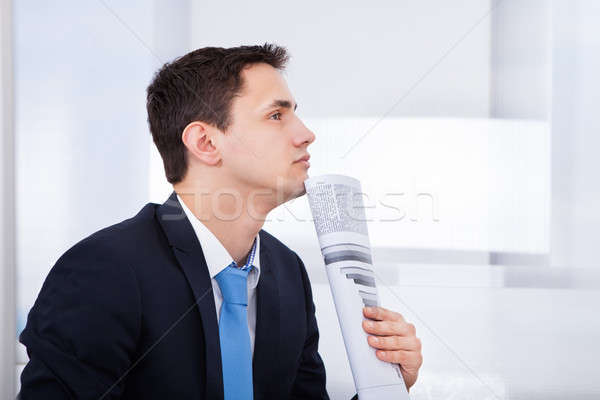 Thoughtful Businessman Holding Documents Stock photo © AndreyPopov