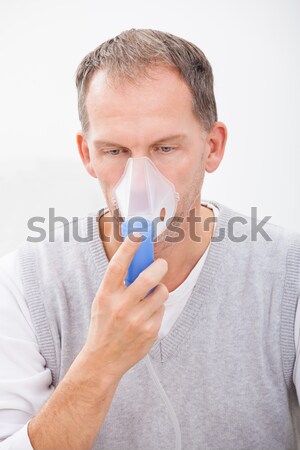 Adam oksijen maskesi ev kitap tıbbi sağlık Stok fotoğraf © AndreyPopov