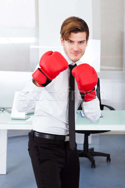 üzletember visel boxkesztyűk fiatal piros munkahely Stock fotó © AndreyPopov