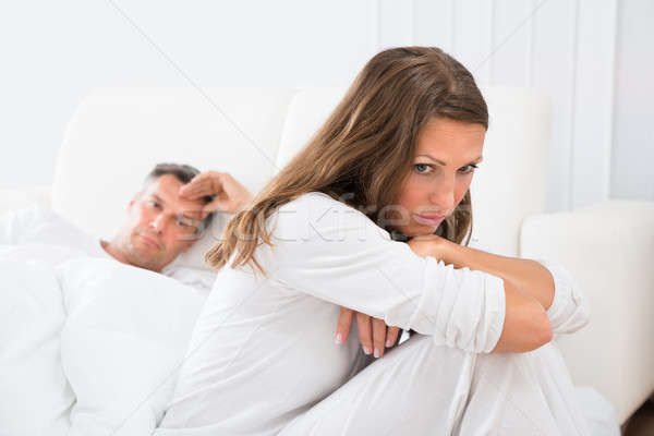 Stock photo: Unhappy Couple In Bedroom