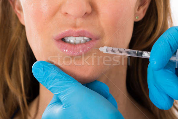 Woman Receive Cosmetic Injection On Lip Stock photo © AndreyPopov