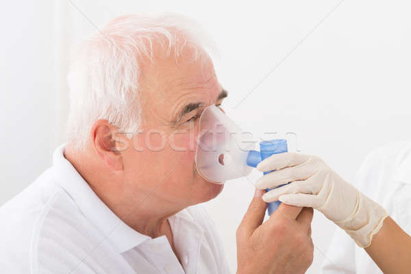 Adam oksijen maskesi klinik kıdemli tıbbi Stok fotoğraf © AndreyPopov
