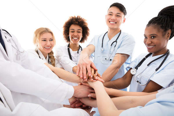 Group Of Doctors Stacking Their Hands Stock photo © AndreyPopov