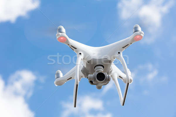 Drone flying against clear blue sky Stock photo © AndreyPopov