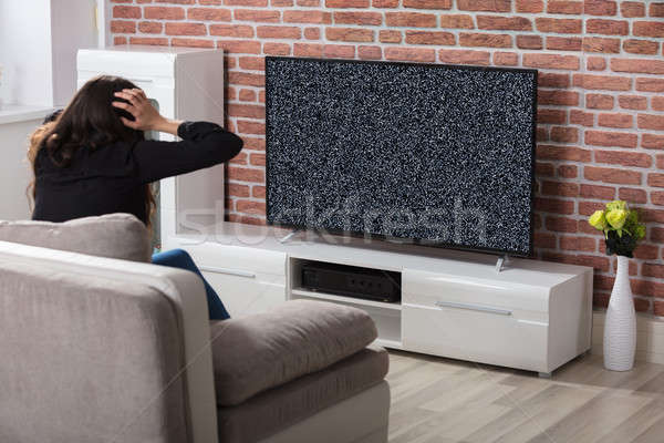 Woman Getting Frustrated With Glitch TV Screen Stock photo © AndreyPopov