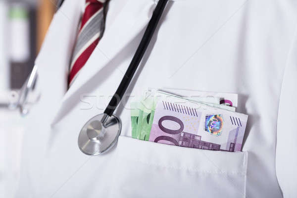 Doctor's Pocket With Banknote Stock photo © AndreyPopov