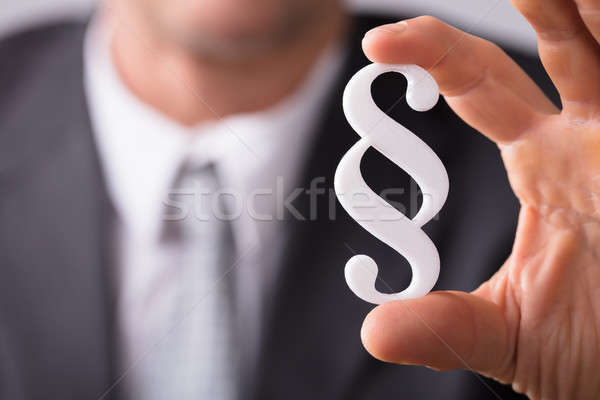 Businessperson Holding Paragraph Symbol Stock photo © AndreyPopov