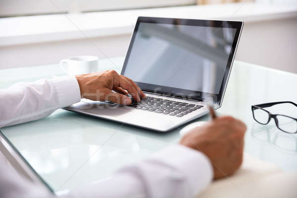 Businessman's Hand Using Laptop Stock photo © AndreyPopov