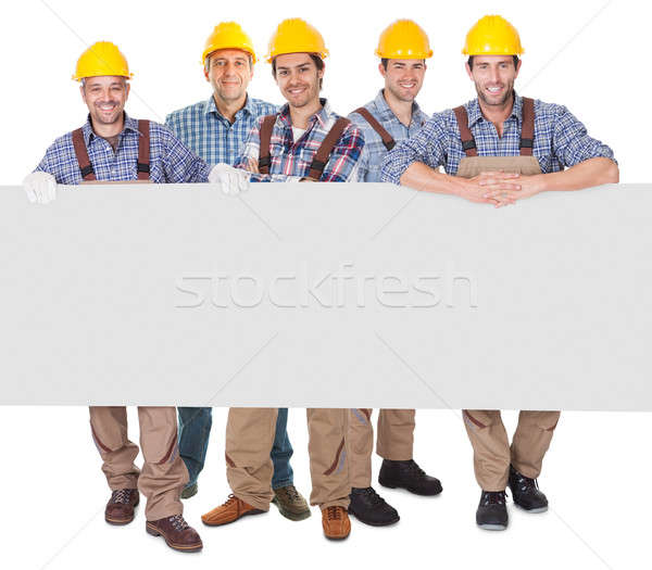 Construction workers presenting empty banner Stock photo © AndreyPopov