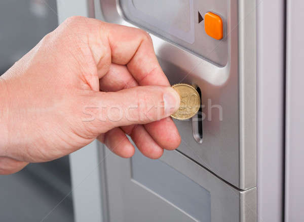 Human hand inserting coin in vending machine Stock photo © AndreyPopov