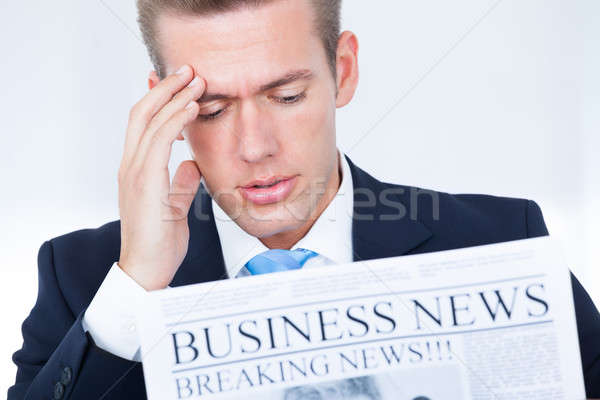 Businessman Reading Newspaper Stock photo © AndreyPopov