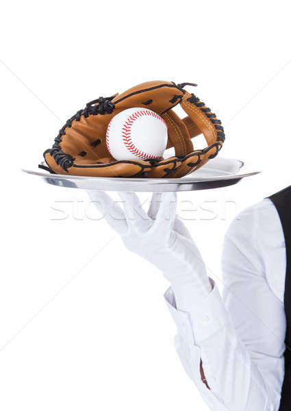 Waiter Carrying Baseball And Catcher's Mitt Stock photo © AndreyPopov