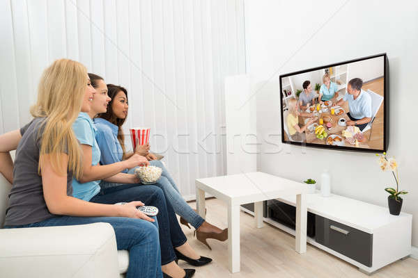 Young Women Watching Movie Stock photo © AndreyPopov