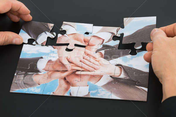 Person Hand Holding Jigsaw Puzzle Stock photo © AndreyPopov