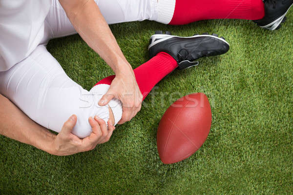 American Football Player With Injury In Leg Stock photo © AndreyPopov