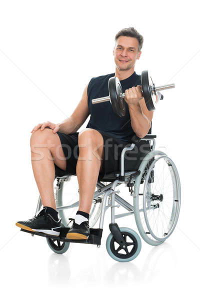 Zdjęcia stock: Niepełnosprawnych · człowiek · wózek · uśmiechnięty