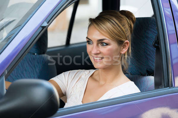 Smiling Woman Driving Car Stock photo © AndreyPopov