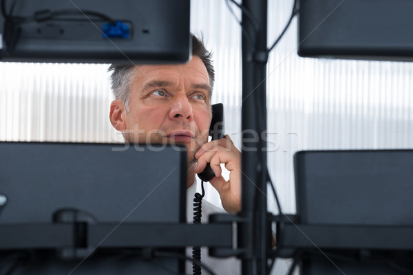Stock Trader Looking At Multiple Computer Screens Stock photo © AndreyPopov