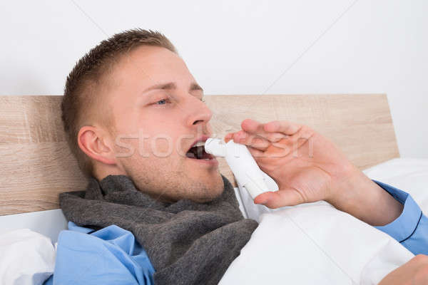 Close-up Of Man Using Asthma Inhaler Stock photo © AndreyPopov