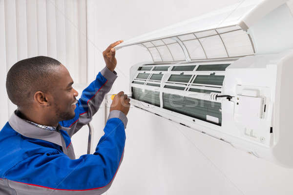 Technician Repairing Air Conditioner Stock photo © AndreyPopov