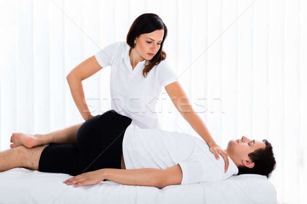 Femminile terapeuta gamba giovani Foto d'archivio © AndreyPopov