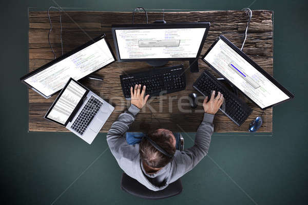 Hacker Stealing Data From Multiple Computer Stock photo © AndreyPopov