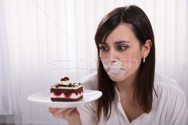 Nő tart szelet torta tányér fiatal nő Stock fotó © AndreyPopov