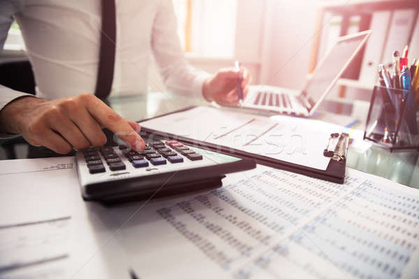 Businessman Checking Invoice Stock photo © AndreyPopov