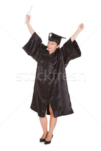 Stock photo: Excited Graduate Woman Holding Certificate