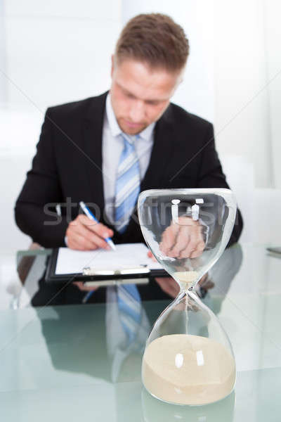 Businessman under time pressure Stock photo © AndreyPopov