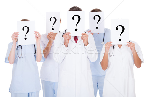 Group Of Doctors With Question Mark Sign Stock photo © AndreyPopov