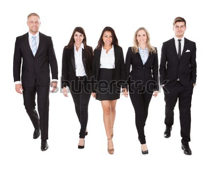 Portrait Of Welldressed Businesspeople Walking Stock photo © AndreyPopov