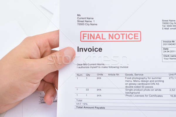 Stock photo: Man Holding Invoice With Final Notice Stamp