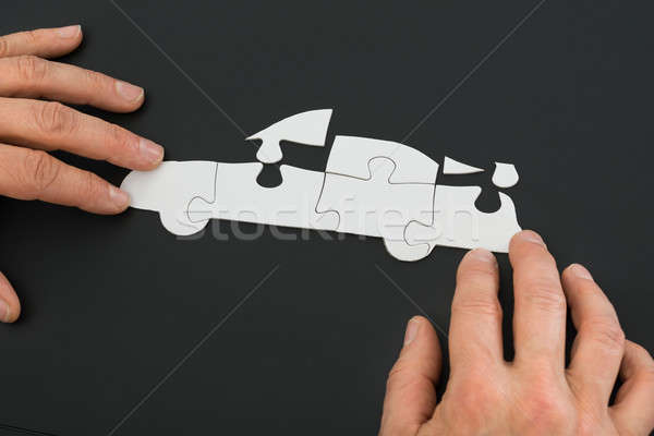 Person Solving Car Jigsaw Puzzle Stock photo © AndreyPopov
