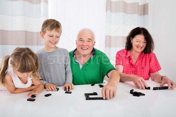 Multi Generation Family Playing Dominoes At Home Stock photo © AndreyPopov