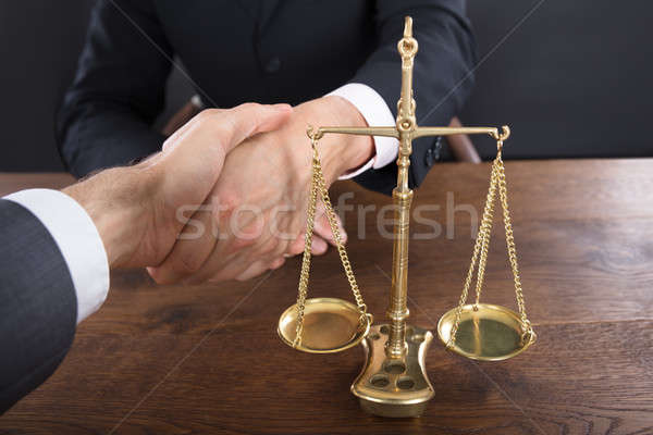 Judge And Client Shaking Hands Near Justice Scale Stock photo © AndreyPopov