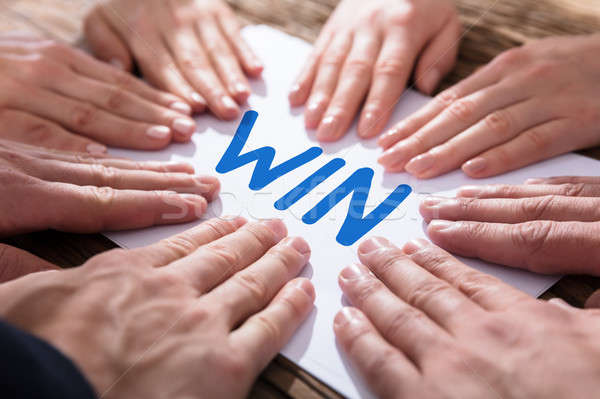 Hands On Paper Showing Win Concept Stock photo © AndreyPopov