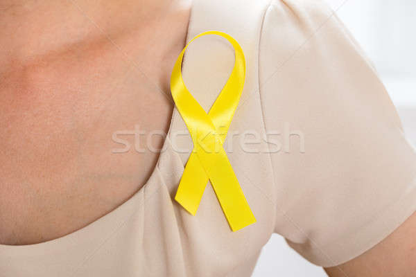 Woman With Gold Ribbon To Support Breast Cancer Cause Stock photo © AndreyPopov