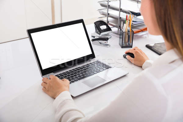 Businesswoman Working On Laptop Stock photo © AndreyPopov