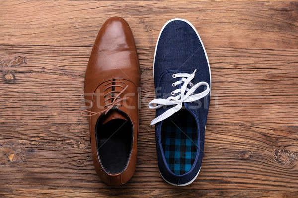 Elevated View Of Two Different Shoe Stock photo © AndreyPopov